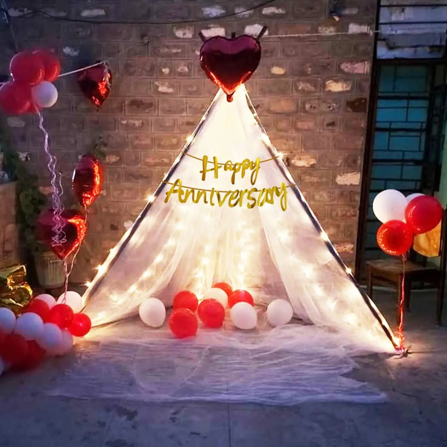 Romantic anniversary decoration with flowers and candle light